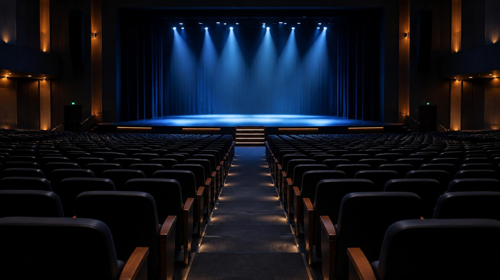 Empty cinema seats facing a screen